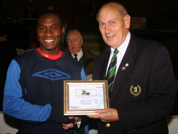 Saheed Sankoh, on behalf of Bobby Traynor, presented with the award by league official Barry Simmons