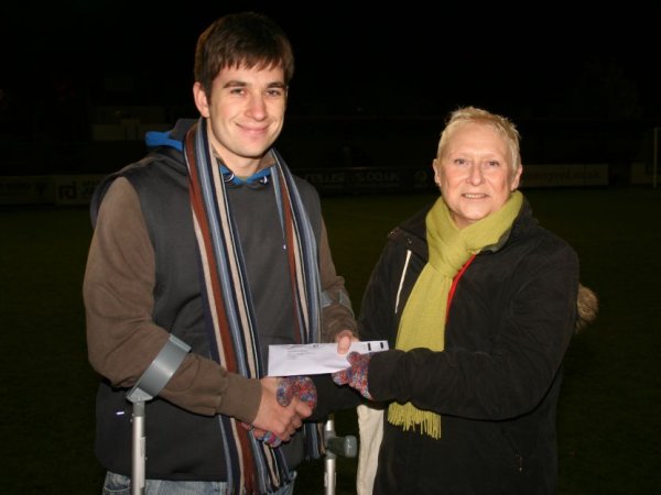 Stuart Reeks presented with a cheque by Vicky Jones