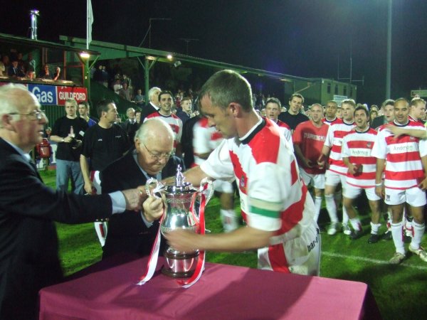 Mick Brady lines up the trophy