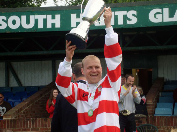 Scott Corbett lifts the trophy