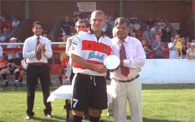 James Pinnock receives a plate from Mr K
