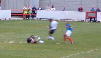 'Keeper Flitney rushes out to deny Browne