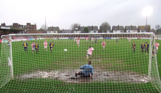 Adolph scores with his yellow football boots