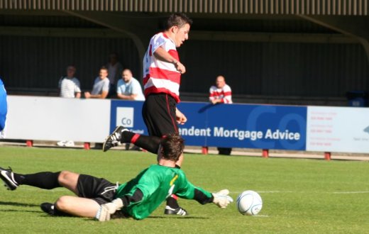 Bobby Traynor rounds the goalkeeper for the opening goal