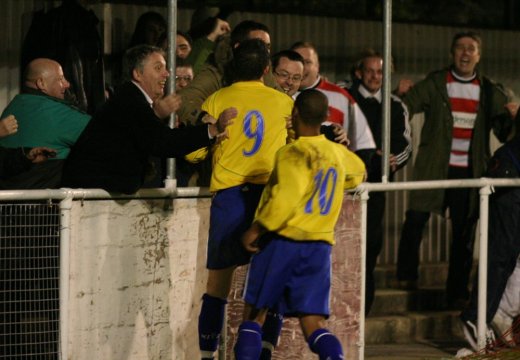 Players celebrate the winner with the fans