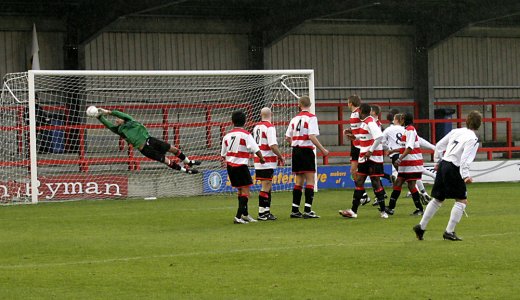 Luke Garrard saves a free kick