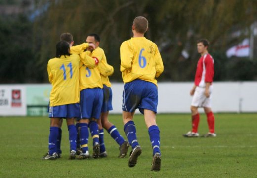 Teammates celebrate with Nick Rundell