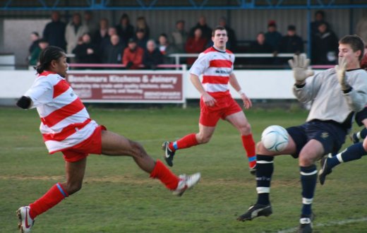 Dean Lodge having an effort on goal