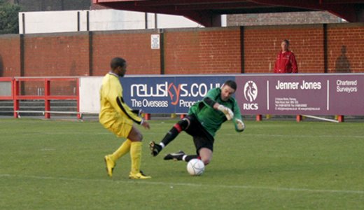 Luke Garrard rushes out to save