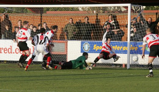 Nick Rundell clears off the line