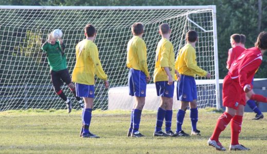 Luke Garrard saves the free kick