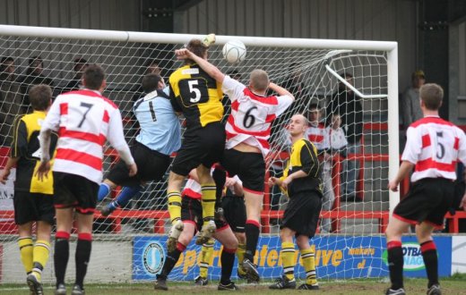 Huckle heads the ball on for a hidden Traynor to poke home