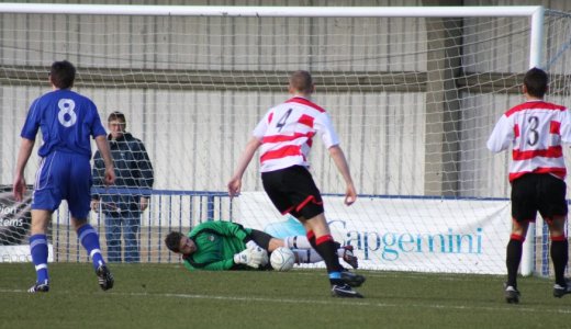 Luke Naughton makes a save down low