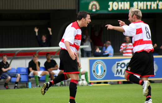 Bobby Traynor congratulated by Tommy Williams