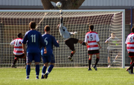 Luke Garrard tips over an effort on goal