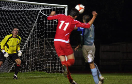 Goalkeeper Luke Garrard keeps a watching brief