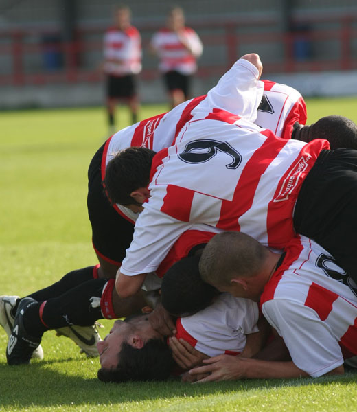 Team mates celebrate Max Hustwick's goal