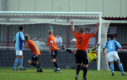 Luke Garrard tips the ball onto the post