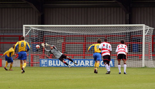 Luke Garrard saves the initial penalty