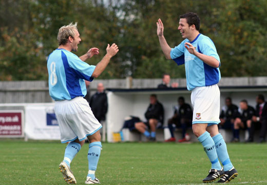 Tommy Williams congratulates Bobby Traynor after the second goal