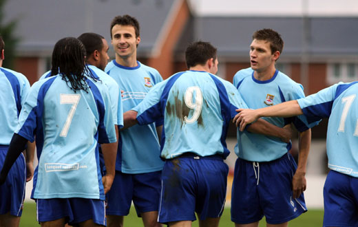 Teammates congratulate Bobby Traynor on the second goal