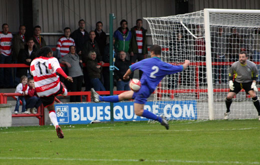 Dean Lodge's shot blocked by a Folkestone defender