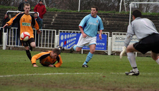 Bobby Traynor squares the ball for the second