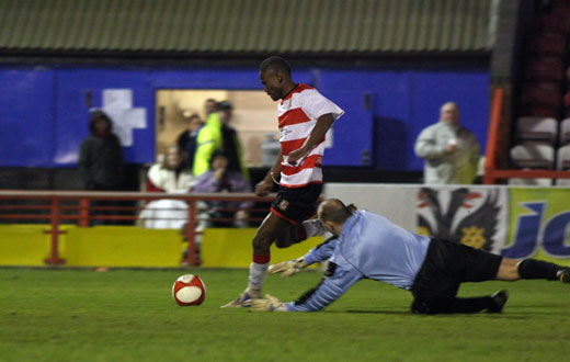 Phil Williams rounds the goalkeeper for the second