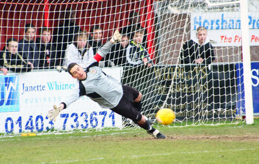 Luke Garrard watches the penalty go wide