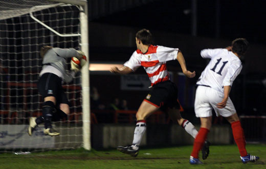 Liam Collins sees his header saved