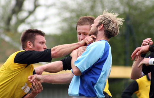 Mark Pulling grabbing the throat of Tommy Williams