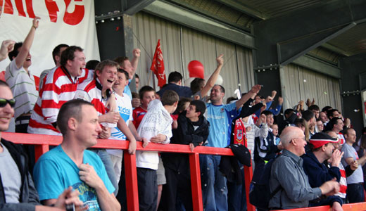 Kingstonian supporters cheers the team on