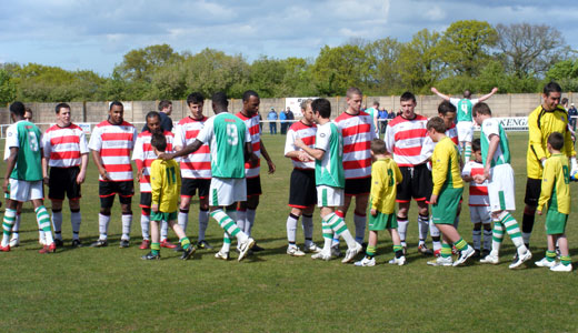 The teams line up before the match