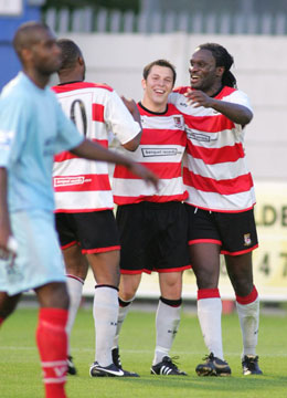 Teammates congratulate goalscorer Bobby Traynor