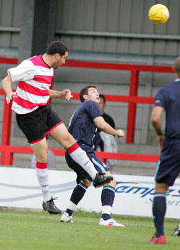 Ian Pearce heads on goal