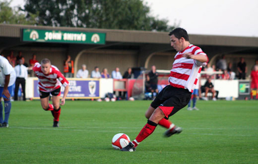 Bobby Traynor scores the third from the penalty spot