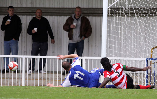 Francis Duku clears off the line