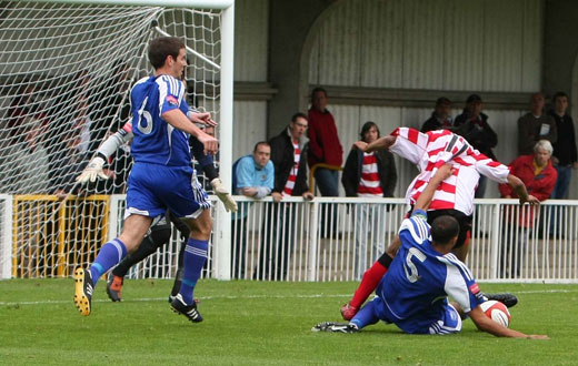 Steve Sutherland challenges Dean Lodge in the box