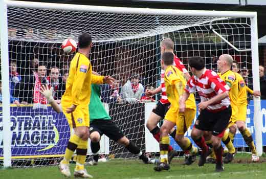 Bobby Traynor heads against the crossbar