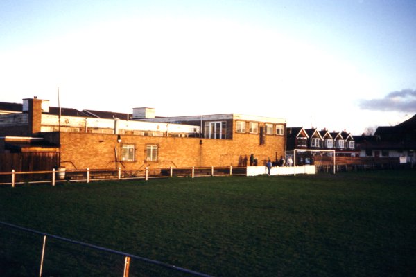 The clubhouse at the far end of the ground